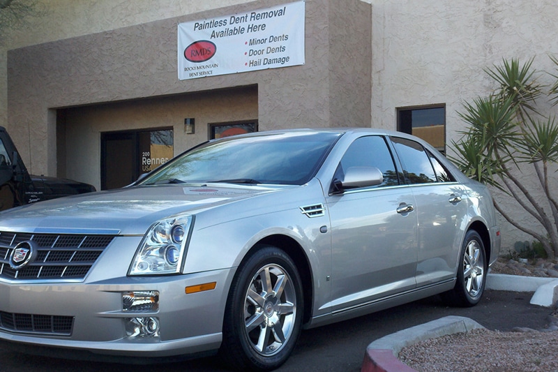 Paintless dents removal from cars